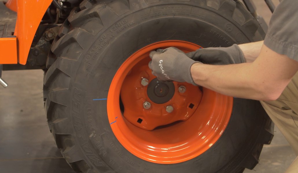 tightening tire on a tractor